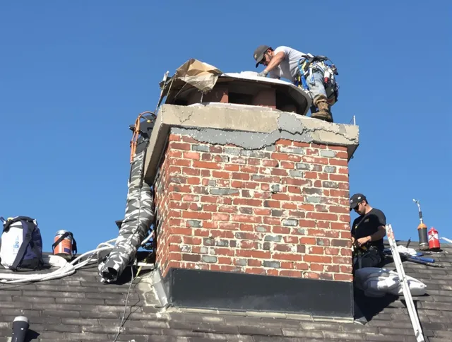 Weddington Chimney Sweep installing a custom chimney crown in Weddington, NC
