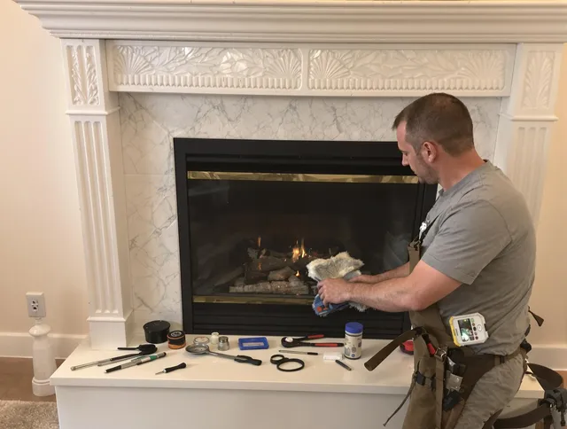 Weddington Chimney Sweep performing fireplace maintenance in Weddington, NC