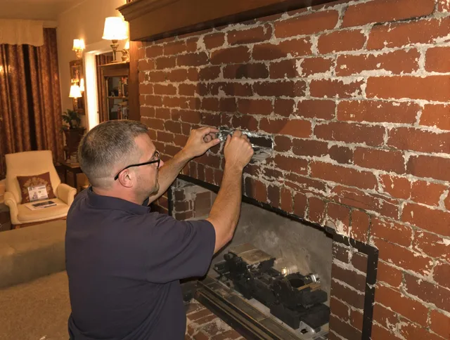 Weddington Chimney Sweep expert fixing a fireplace in Weddington, NC